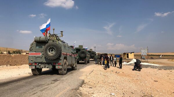 Патруль военной полиции России в районе Кобани на сирийско-турецкой границе