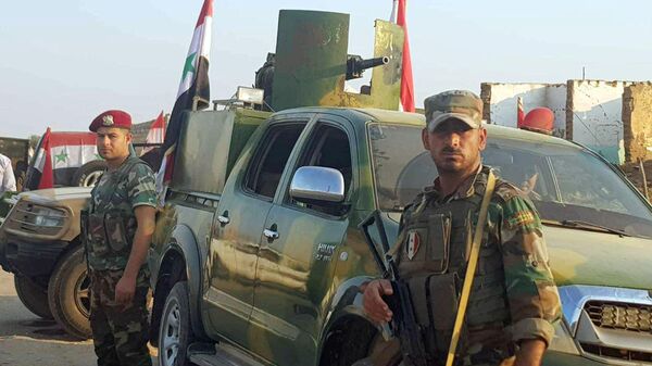 Сирийские военные в деревне Аль-Америт к западу от Абу-Расина в районе Рас-Аль-Айн