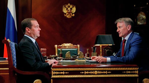 Председатель правительства РФ Дмитрий Медведев и президент, председатель правления Сбербанка России Герман Греф во время встречи