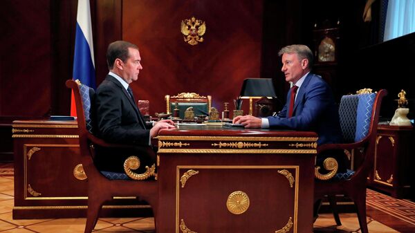  Дмитрий Медведев и президент, председатель правления Сбербанка России Герман Греф во время встречи