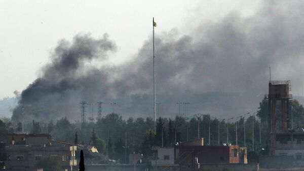 Дым над городом Телль-Абьяд, Сирия