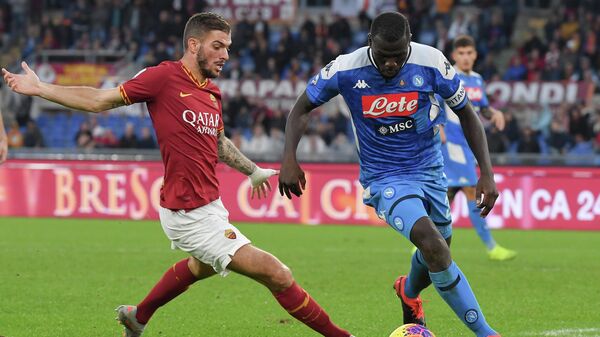 AS Roma's Italian defender Davide Santon fights for the ball with Napoli's Senegalese defender Kalidou Koulibaly during the Italian Serie A football match between AS Roma and Napoli at the Olympic stadium in Rome, on November 2, 2019. (Photo by Tiziana FABI / AFP)