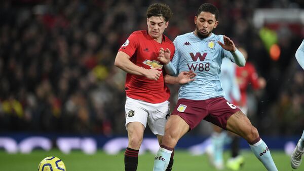 Manchester United's Welsh midfielder Daniel James (L) vies with Aston Villa's Brazilian midfielder Douglas Luiz (R) during the English Premier League football match between Manchester United and Aston Villa at Old Trafford in Manchester, north west England, on December 1, 2019. (Photo by Oli SCARFF / AFP) / RESTRICTED TO EDITORIAL USE. No use with unauthorized audio, video, data, fixture lists, club/league logos or 'live' services. Online in-match use limited to 120 images. An additional 40 images may be used in extra time. No video emulation. Social media in-match use limited to 120 images. An additional 40 images may be used in extra time. No use in betting publications, games or single club/league/player publications. / 