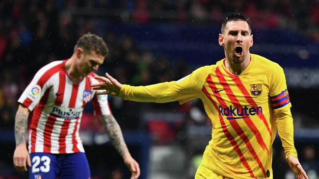 Barcelona's Argentine forward Lionel Messi celebrates after scoring  during the Spanish league football match between Club Atletico de Madrid and FC Barcelona at the Wanda Metropolitano stadium in Madrid, on December 1, 2019. (Photo by GABRIEL BOUYS / AFP)