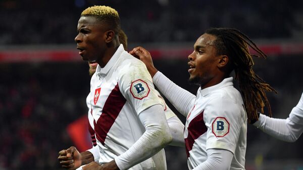 Lille's Nigerian forward Victor Osimhen (L) celebrates with teammates after scoring a goal during the French L1 football match between Lille (LOSC) and Dijon (DFCO) at the Pierre-Mauroy Stadium in Villeneuve d'Ascq, near Lille, northern France, on November 30, 2019. (Photo by DENIS CHARLET / AFP)