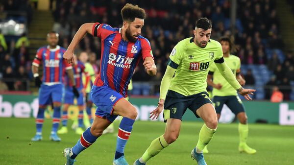 Crystal Palace's English midfielder Andros Townsend vies with Bournemouth's Spanish defender Diego Rico (R) during the English Premier League football match between Crystal Palace and Bournemouth at Selhurst Park in south London on December 3, 2019. (Photo by Glyn KIRK / AFP) / RESTRICTED TO EDITORIAL USE. No use with unauthorized audio, video, data, fixture lists, club/league logos or 'live' services. Online in-match use limited to 120 images. An additional 40 images may be used in extra time. No video emulation. Social media in-match use limited to 120 images. An additional 40 images may be used in extra time. No use in betting publications, games or single club/league/player publications. / 