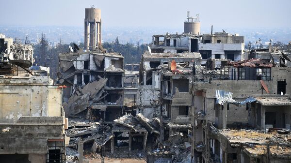 Разрушенные дома в пригороде Дамаска