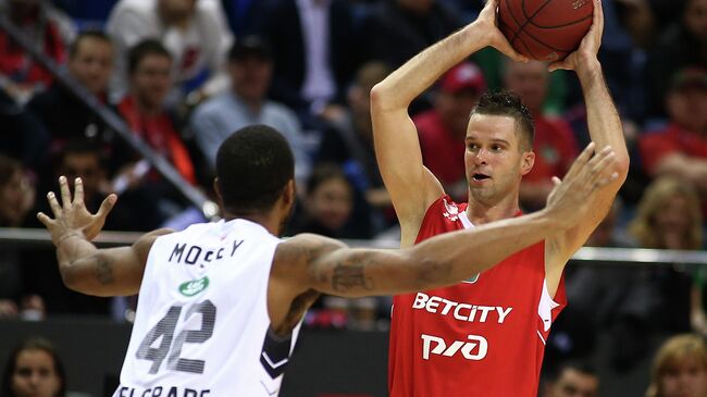 Lokomotiv-Kuban's Mantas Kalniets, right, and Partizan's William Mosley struggle for a ball during the Euroleague basketball match between Lokomotiv-Kuban Krasnodar and Partizan Belgrade, in Krasnodar, Russia.