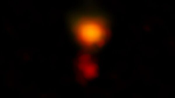  Радиоизображение двух частей пыльной звездообразующей галактики Mambo-9, полученное радиотелескопом ALMA
