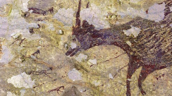 Пещерная живопись, датируемая возрастом 44 000 лет,  найденная в известняковой пещере на острове Сулавеси, Индонезия 