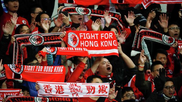 Hongkongers cheer at a soccer match between Hong Kong and China during 2019 EAFF E-1 Football Championship at Busan Asiad Stadium in Busan, South Korea, December 18, 2019.   REUTERS/Kim Hong-Ji