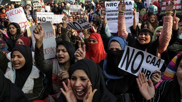Участники акции протеста против нового закона о гражданстве в Индии