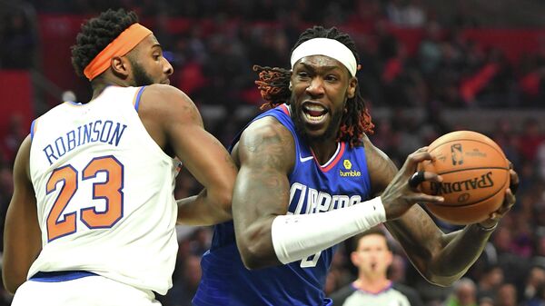 Jan 5, 2020; Los Angeles, California, USA;  New York Knicks center Mitchell Robinson (23) guards Los Angeles Clippers forward Montrezl Harrell (5) as he drives to the basket in the second half of the game at Staples Center. Mandatory Credit: Jayne Kamin-Oncea-USA TODAY Sports