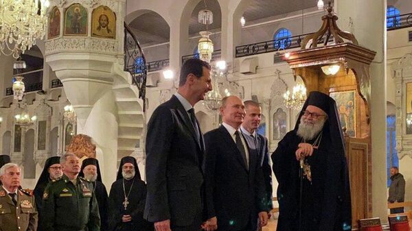 Президент России Владимир Путин и президент Сирийской Арабской Республики Башар Асад в Соборе Святой Девы Марии в Дамаске, Сирия. 7 января 2020