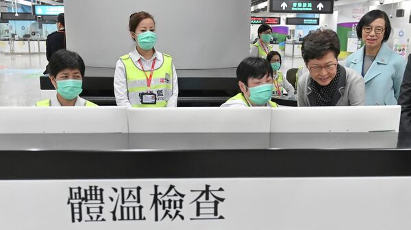 Пункт контроля состояния здоровья пассажиров на станции Западный Коулун в Гонконге
