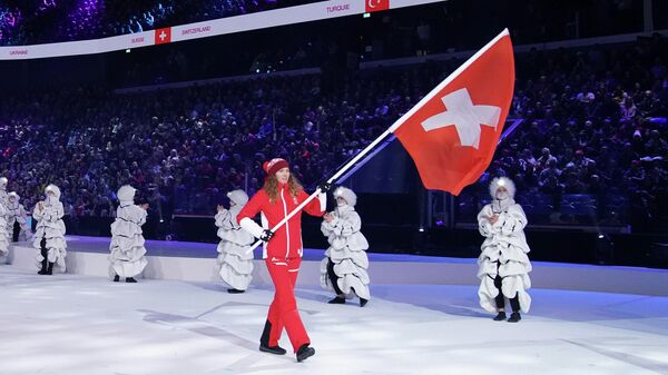 Olympics - 2020 Winter Youth Olympics - Lausanne, Switzerland - January 9, 2020  Thibe Deseyn, the flag bearer for Switzerland arriving during the Parade of NOC flags during the Opening Ceremony at the Lausanne Vaudoise Arena.  Joe Toth for OIS/IOC/Handout via REUTERS    ATTENTION EDITORS - THIS IMAGE HAS BEEN SUPPLIED BY A THIRD PARTY.