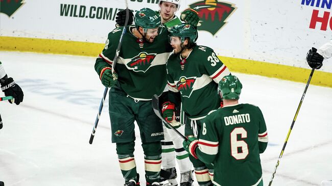 Jan 18, 2020; Saint Paul, Minnesota, USA; Minnesota Wild forward Ryan Hartman (38) celebrates his goal with forward Jordan Greenway (18) during the third period against the Dallas Stars at Xcel Energy Center. Mandatory Credit: Brace Hemmelgarn-USA TODAY Sports