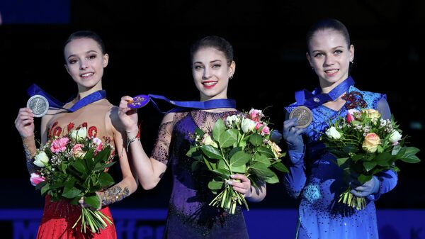 The prize -winners of the European Figure Skating Championship in women's single skating at the award ceremony (left to right): Anna Shcherbakova (Russia) - Silver Medal, Alena Kostornaya (Russia) - Gold Medal, Alexander Trusova (Russia) - bronze medal.