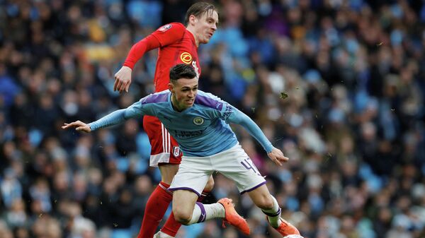 Soccer Football - FA Cup Fourth Round - Manchester City v Fulham - Etihad Stadium, Manchester, Britain - January 26, 2020  Manchester City's Phil Foden in action with Fulham's Stefan Johansen   REUTERS/Phil Noble
