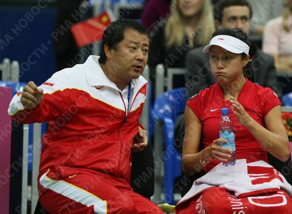 Капитан сборной Китая Ки Чжан и теннисистка Янь Цзы (слева направо)