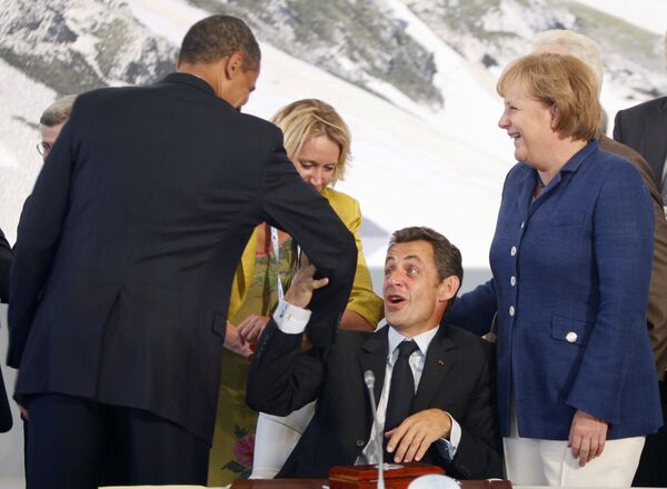 Барак Обама, Николя Саркози и Ангела Меркель на саммите G8 в Аквиле