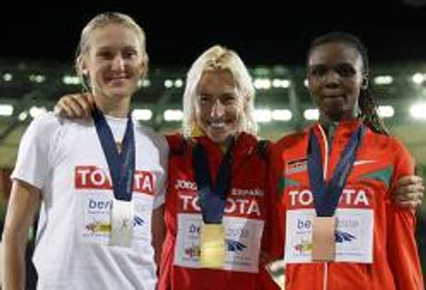 Победительницы ЧМ по легкой атлетике на дистанции 3000 м с препятствиями  Юлия Заруднева, Марта Домингес и Милка Чемос Чейве (слева направо)