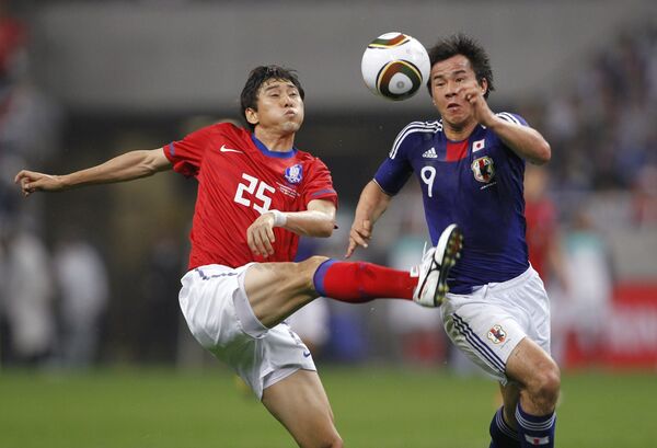 Игровой момент матча Япония - Южная Корея
