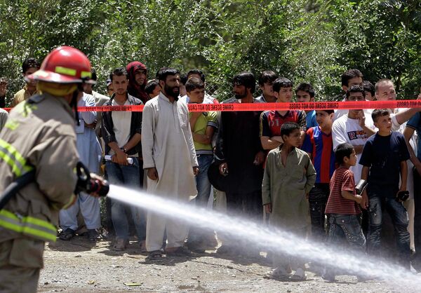 На месте взрыва, устроенного террористом-смертником в Кабуле