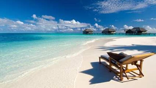 Виллы и пляж спа-отеля Conrad Maldives
