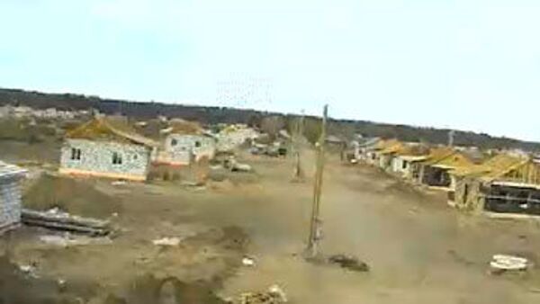 Стоп-кадр он-лайн трансляции строительства домов в поселке Николаевка Алтайского края