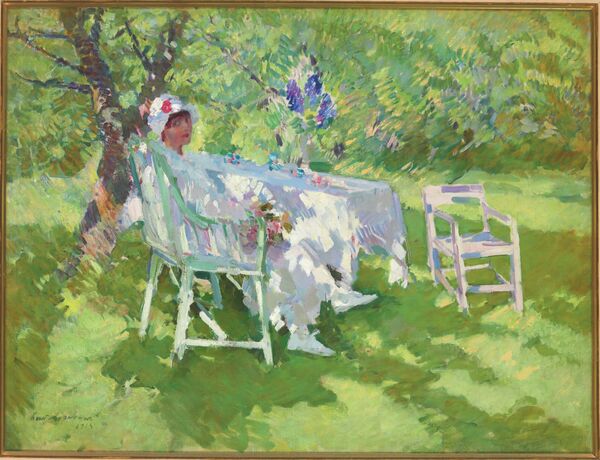 Константин Коровин. Девушка в белом, сидящая в саду