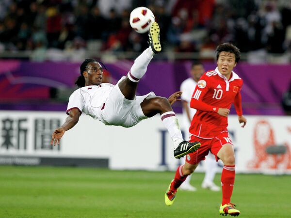 Игровой момент матча Катар - Китай