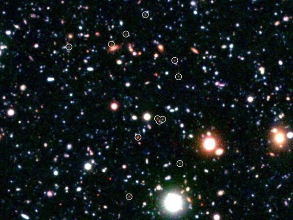 Самое далекое скопление галактик COSMOS-AzTEC3, расположенное в 12,6 световых лет от Земли