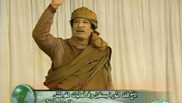 Ливийский лидер Муамар Каддафи во время выступления