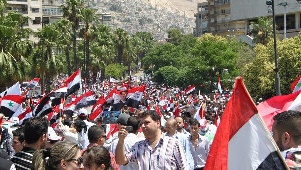 Массовые демонстрации в поддержку режима Асада в Дамаске