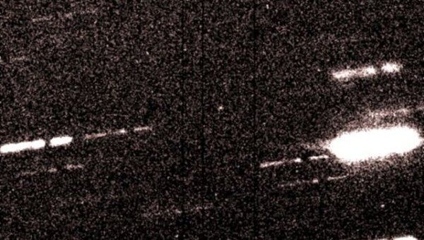 Астероид 2010 TK7 (в центре) на снимке с телескопа CFHT