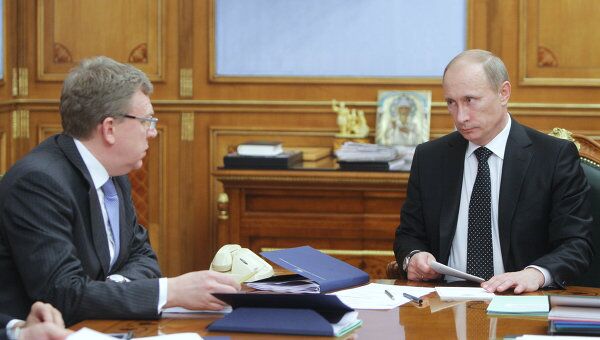 Министр финансов РФ Алексей Кудрин на встрече с премьер-министром РФ Владимиром Путиным