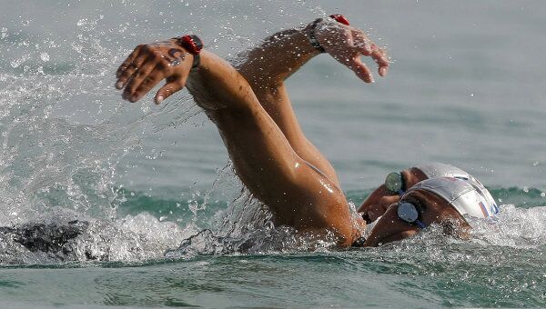 Олимпийская чемпионка, восьмикратная чемпионка мира по плаванию на открытой воде Лариса Ильченко (на первом плане)