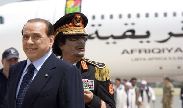 Сильвие Берлускони и Муамар Каддафи