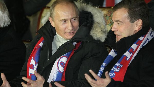 Президент РФ Владимир Путин и премьер-министр Дмитрий Медведев на футбольном матче. Архив