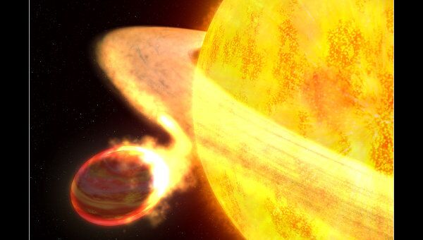 Так художник представляет себе планету WASP-12b и «поедающую» ее звезду Credit: NASA, ESA, G. Bacon (STScI)