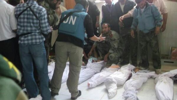 Тела погибших при артобстреле города Хула в Сирии