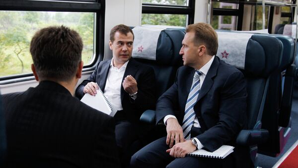 Дмитрий Медведев и Игорь Шувалов в аэроэкспрессе во время поездки в аэропорт города Владивостока. Архив