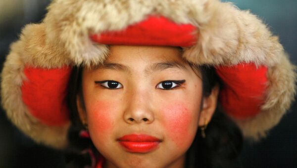 Жительница Тибета на праздновании Дня Рождения Далая Ламы