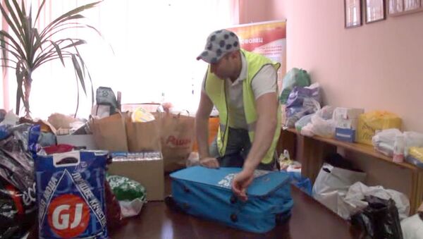 Волотеры собирают гуманитарную помощь для жителей Крымска в Москве 