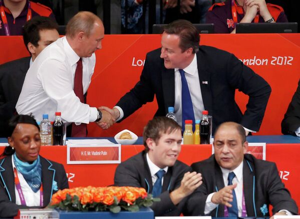 Президент России Владимир Путин и премьер-министр Великобритании Дэвид Кэмерон
