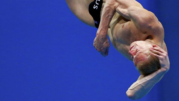 Россиянин Илья Захаров, завоевавший серебряную медаль в соревнованиях по прыжкам в воду
