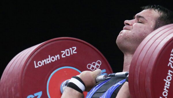 Руслан Албегов в соревнованиях по тяжелой атлетике на ХХХ летних Олимпийских играх в Лондоне.