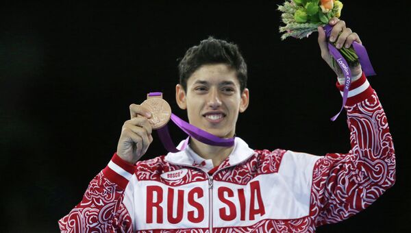 Россиянин Алексей Денисенко, завоевавший бронзовую медаль на соревнованиях по тхэквондо