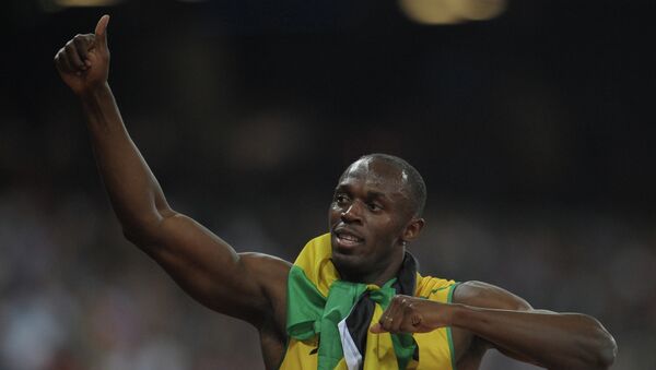 Ямайский спортсмен Усэйн Болт, занявший первое место в забеге на 200 м